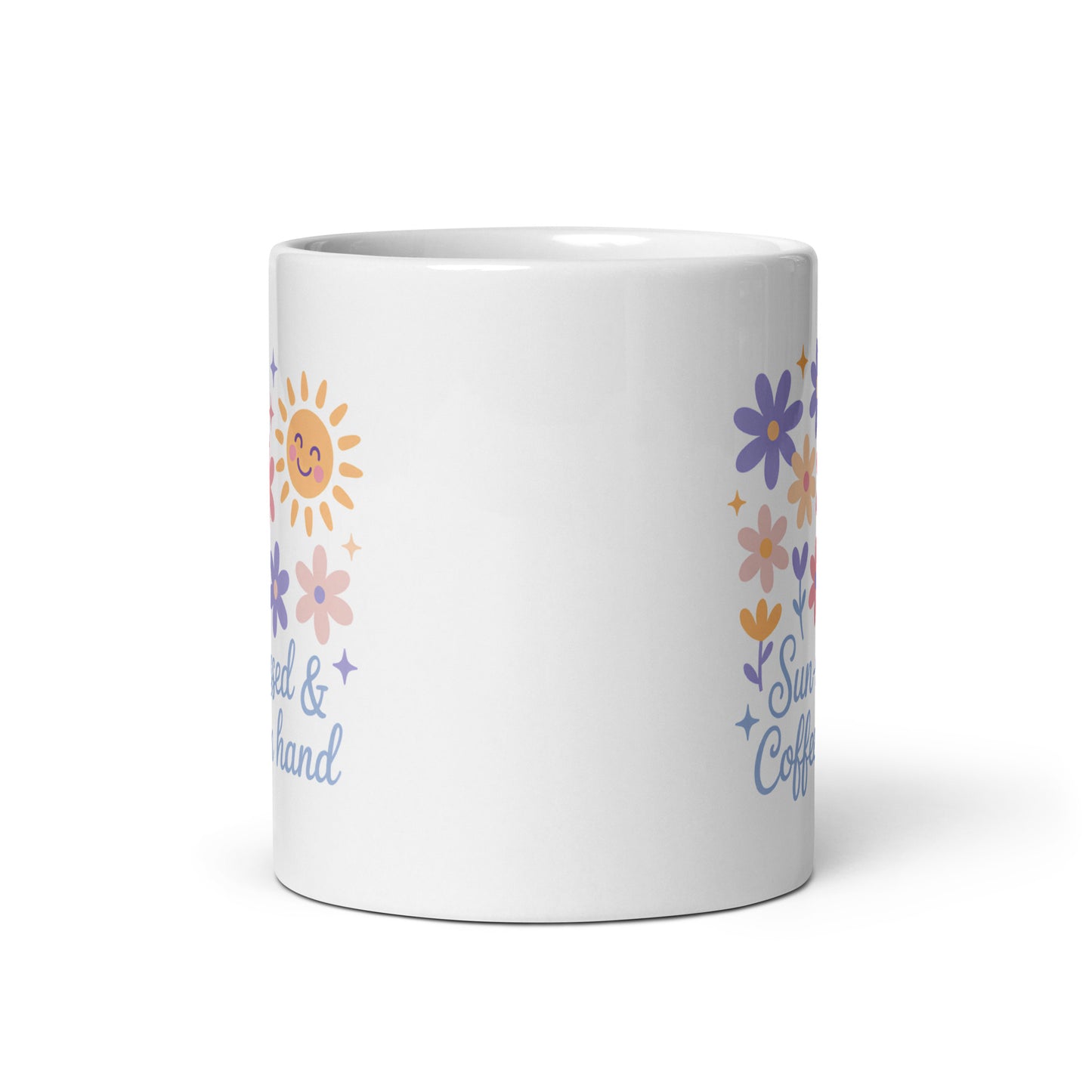 White ceramic mug with pastel flowers, smiling sun, and “Sun-kissed & Coffee in Hand” text – handle on the right side – summer coffee mug for moms by Happily Styled