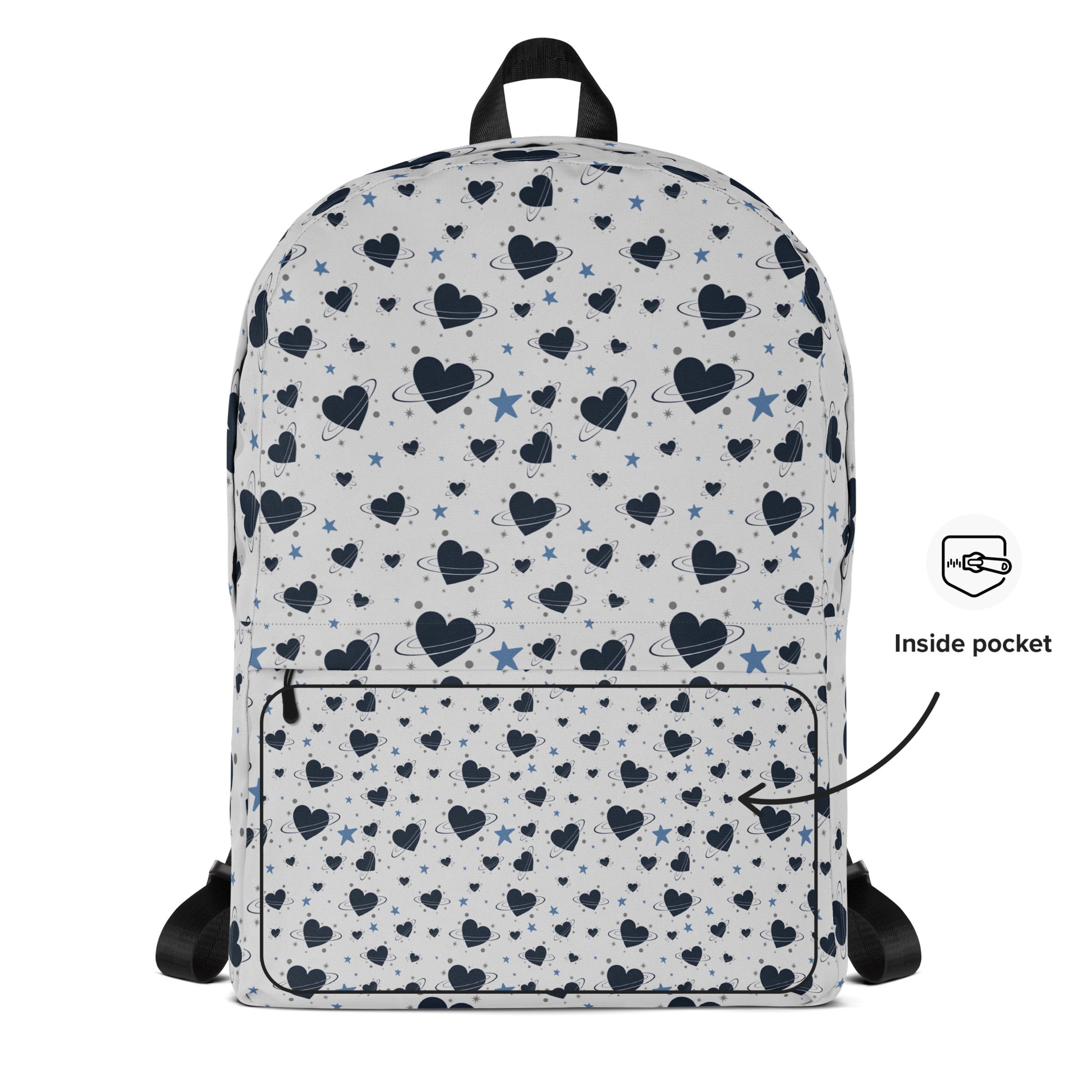 White backpack with all-over navy heart and star pattern, front pocket and visible inside pocket label 