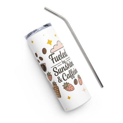 Angled top-down view of a white stainless steel tumbler with metal straw, decorated with ‘Fueled by Sunshine & Caffeine’ quote and cute summer icons.