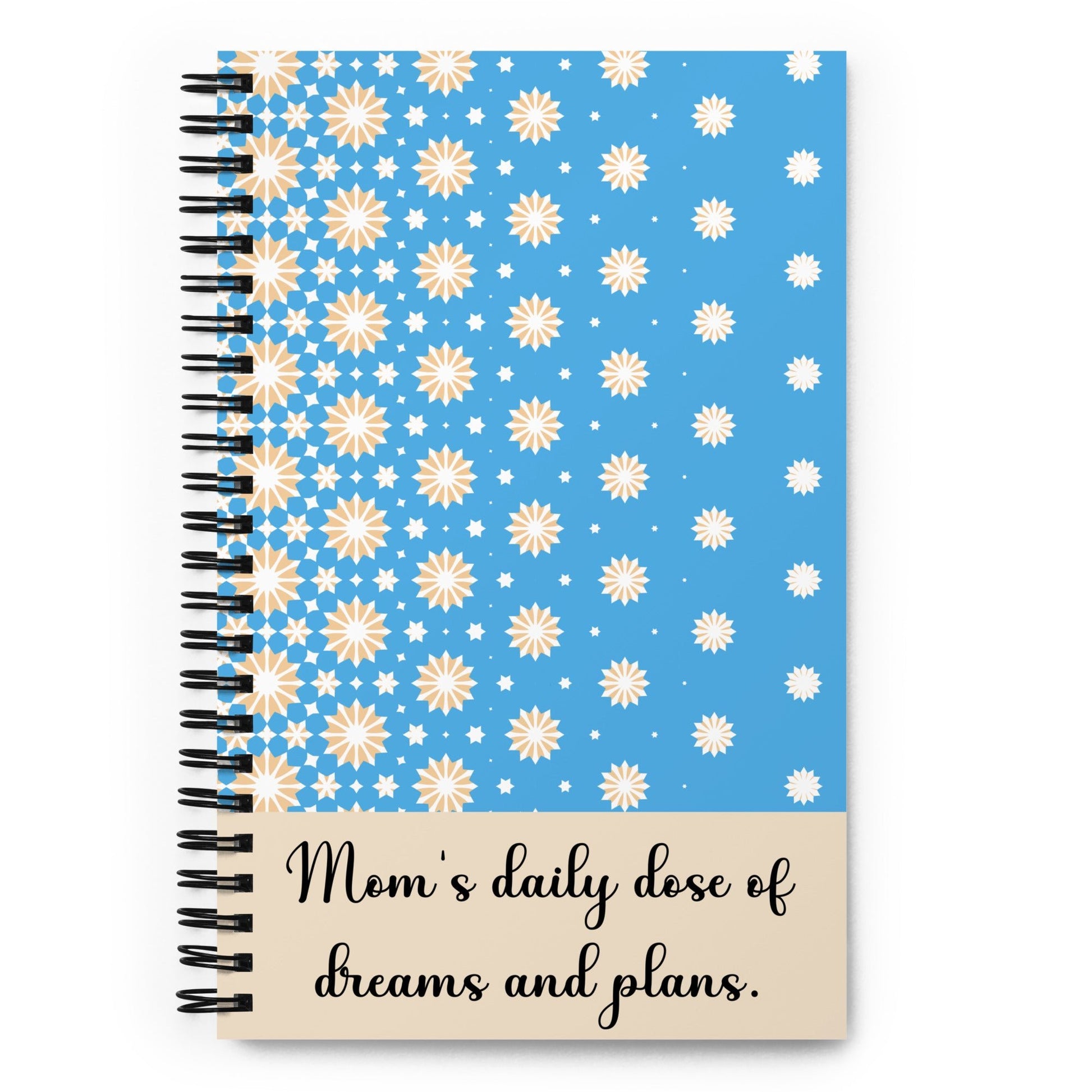 Blue spiral notebook with yellow and white stars design and “Mom’s daily dose of dreams and plans” quote - front cover