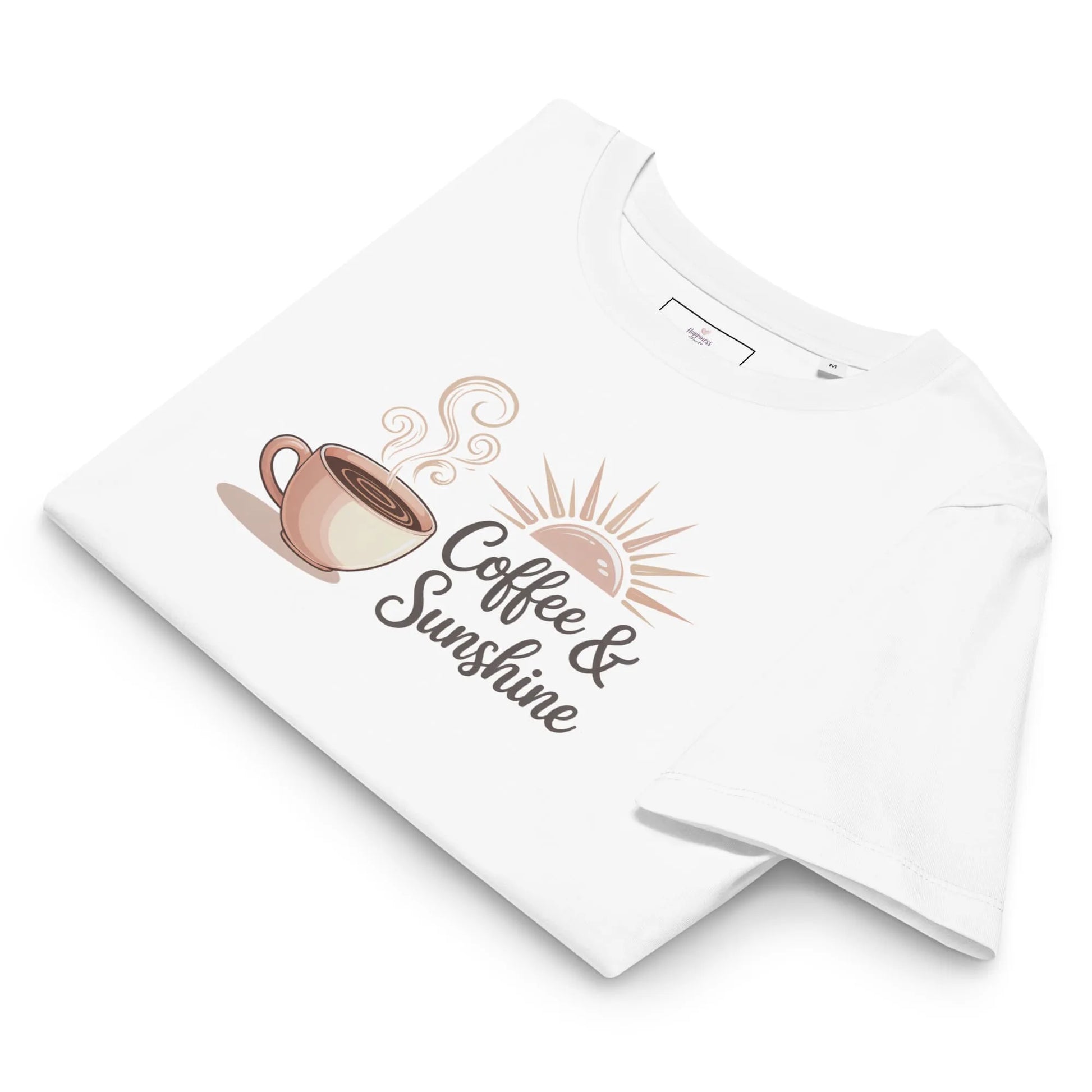 Flatlay of white organic cotton t-shirt with “Coffee & Sunshine” design. Cozy summer mom shirt on a soft background.