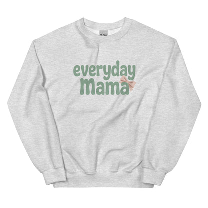 Flat lay of light grey Everyday Mama sweatshirt with sage green lettering and pink bow accent.