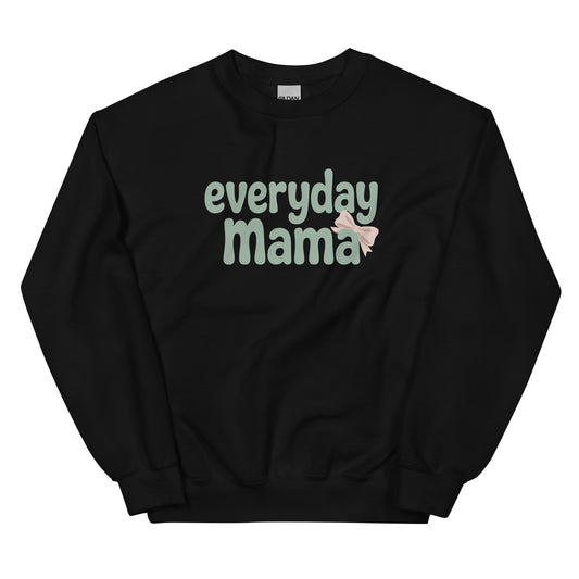 Flat lay of black Everyday Mama sweatshirt with green bubble lettering and pink bow.