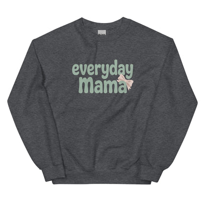 Flat lay of dark grey Everyday Mama sweatshirt with green text and a blush pink bow.