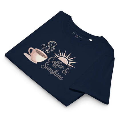 Flatlay of navy blue organic cotton t-shirt with “Coffee & Sunshine” design. Cozy summer mom shirt on a white background.