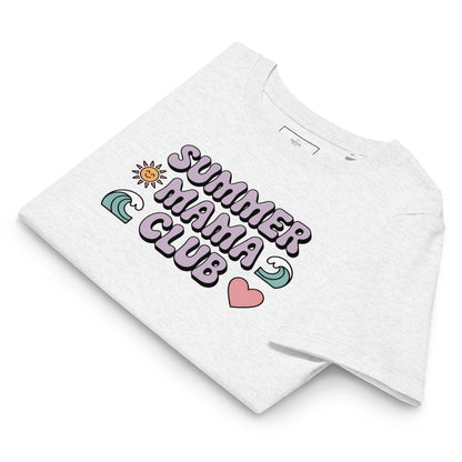 Folded light grey t-shirt with pastel "Summer Mama Club" design featuring waves, sun, and heart icons, displayed on white background.