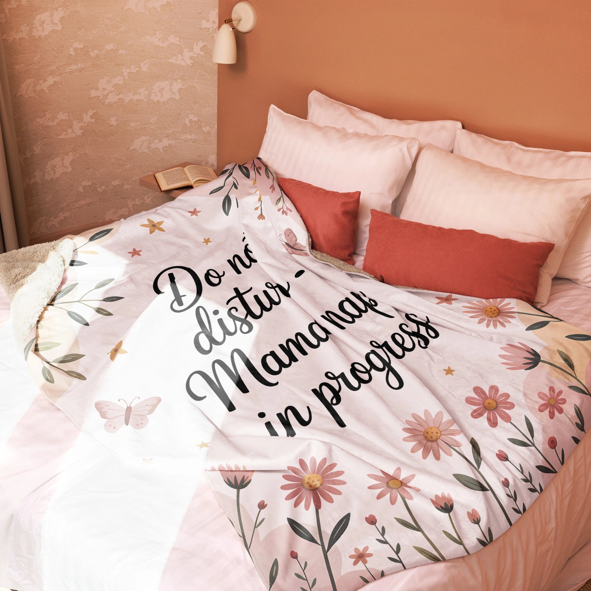 “Mama nap in progress” blanket on blush-toned bed, cozy pastel floral decor style - large blanket.