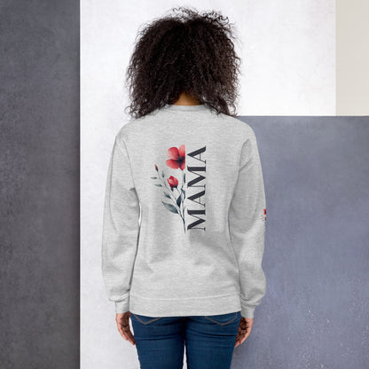 Smiling woman wearing ash sweatshirt with floral design detail on the sleeve - back view