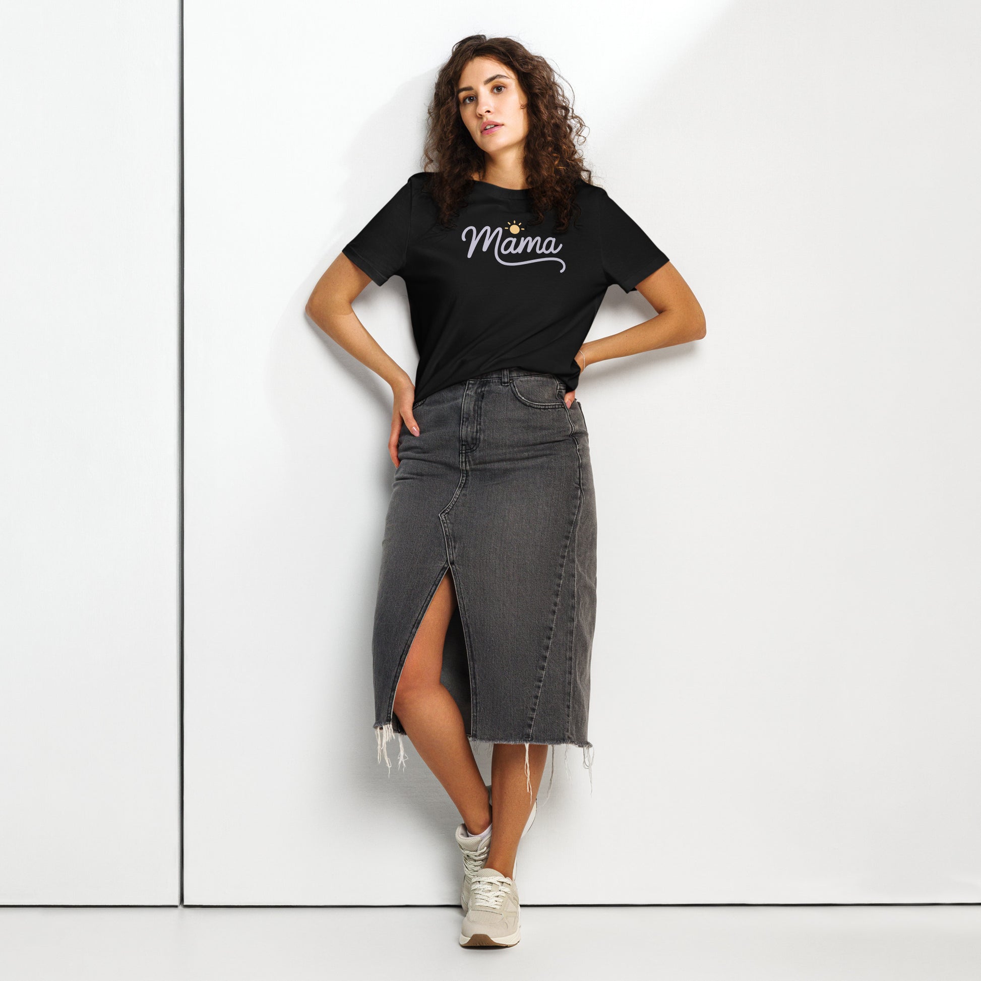 Woman wearing black t-shirt with “Mama” script and sun icon, styled with a denim skirt – minimalist summer mom shirt mockup