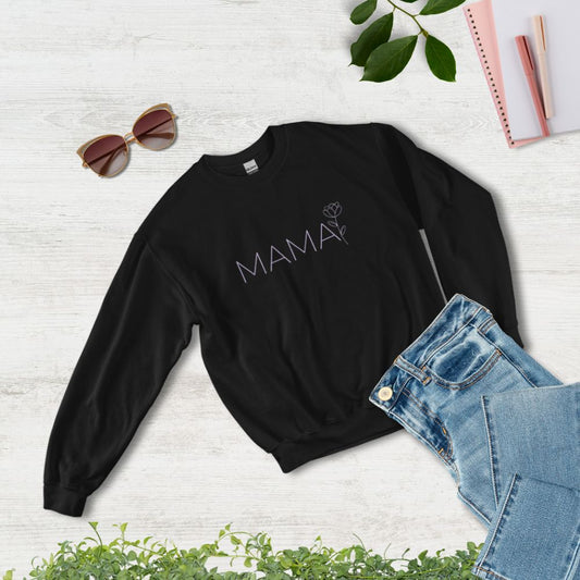 Flat lay of MAMA black sweatshirt styled with jeans, sunglasses, and notebook – cozy and chic gift for moms