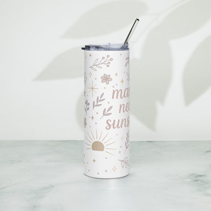 Front view of stainless steel summer tumbler with pastel floral design and “Mama Needs Sunshine” quote on white background