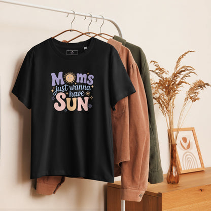 Black t-shirt with “Moms Just Wanna Have Sun” pastel design hanging on clothing rack – cozy styled product photo for summer t-shirt for moms