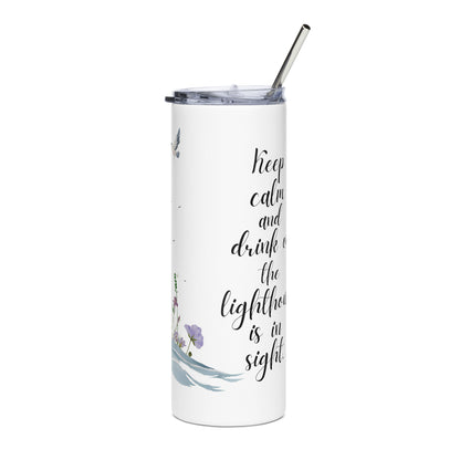 Stainless steel tumbler with a lighthouse-themed design and the phrase “Keep calm and drink on, the lighthouse is in sight” on a white background 