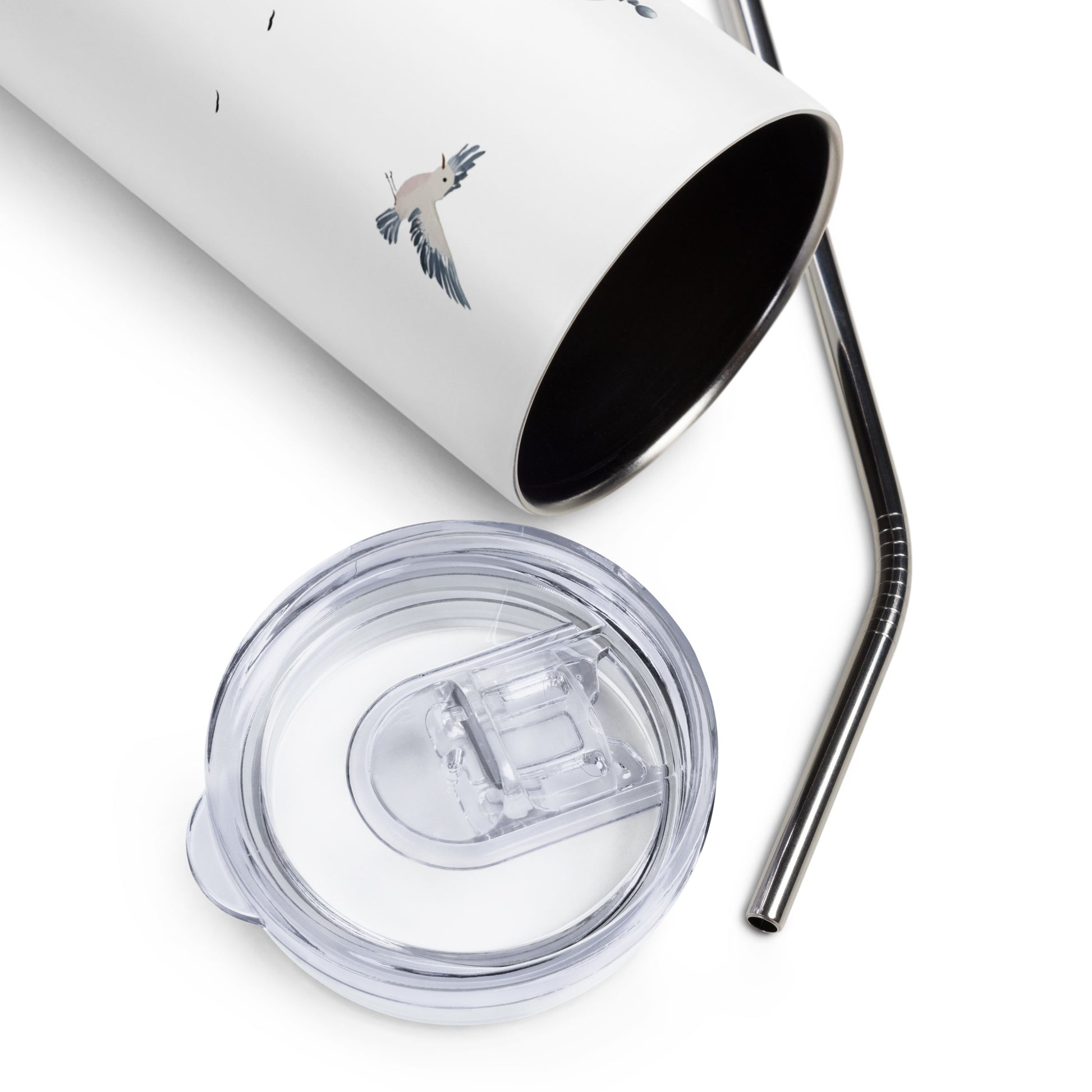 Close-up of an open stainless steel tumbler with a silver straw and clear lid, featuring a flying seagull illustration on a white background.