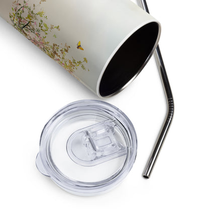 Close-up of a pastel floral stainless steel tumbler with a metal straw and clear lid, shown on a white background.