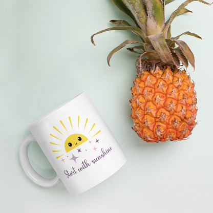White coffee mug with smiling sun and sparkles, placed next to a fresh pineapple on pastel background — tropical summer flat lay with cozy morning vibes.