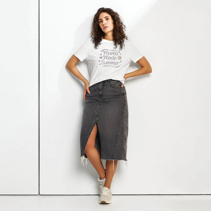 Model wearing white 'Mama Mode: Summer' t-shirt paired with a dark denim skirt, standing against a white background