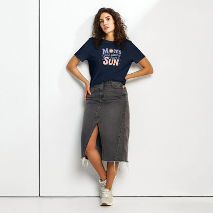 Woman wearing a navy blue t-shirt with “Moms Just Wanna Have Sun” design in pastel colors – styled summer t-shirt for moms