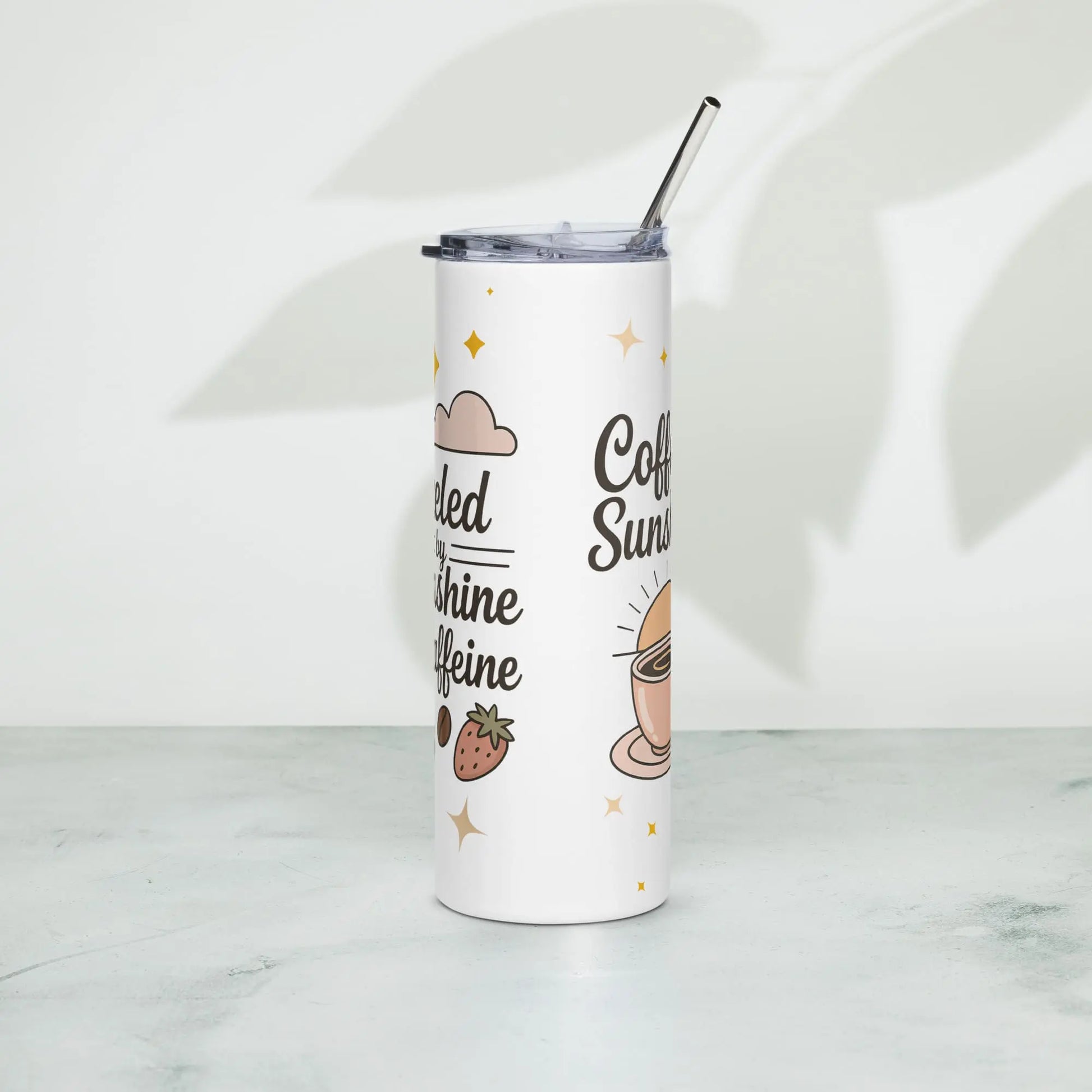 Stainless steel tumbler standing on marble surface with text ‘Fueled by Sunshine & Caffeine’. Soft shadow background with pastel coffee-themed illustrations. Ideal for moms.