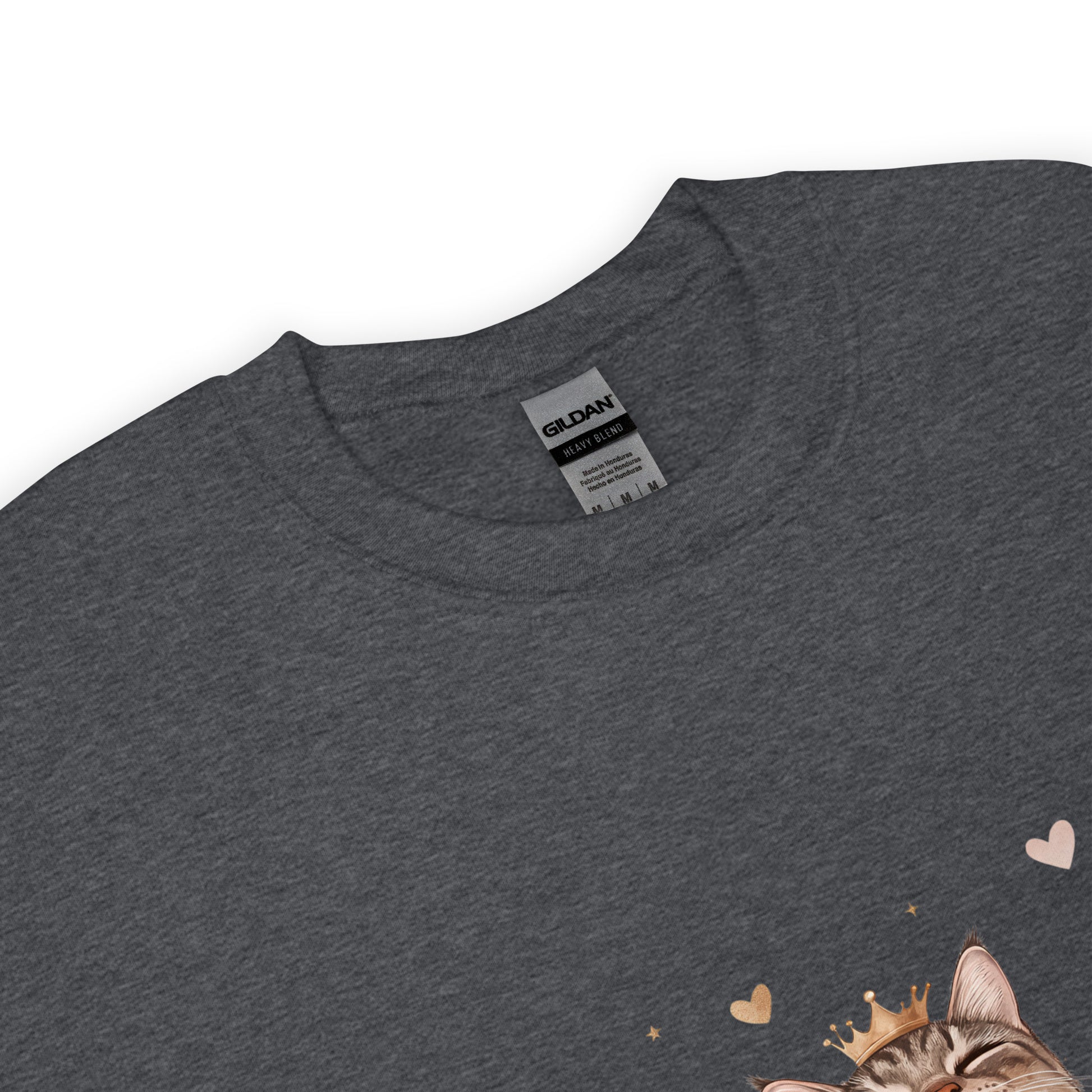 Close-up of a dark heather sweatshirt collar with Gildan label visible and part of a cat graphic wearing a crown with tiny hearts.