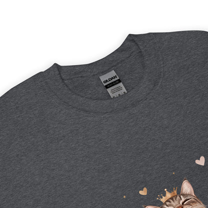 Close-up of a dark heather sweatshirt collar with Gildan label visible and part of a cat graphic wearing a crown with tiny hearts.