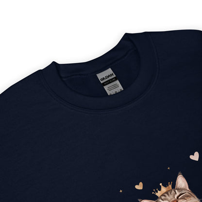 Close-up of a navy blue sweatshirt collar with Gildan label visible and part of a cat graphic wearing a crown with tiny hearts.