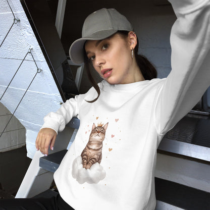 Woman wearing a white sweatshirt with a realistic cat sitting on a white cloud, surrounded by floating hearts. She is sitting casually on stairs, wearing a gray cap and looking relaxed