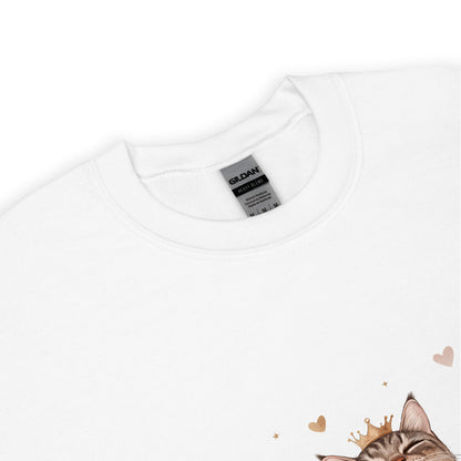 Close-up of a white sweatshirt collar with Gildan label visible and part of a cat graphic wearing a crown with tiny hearts.