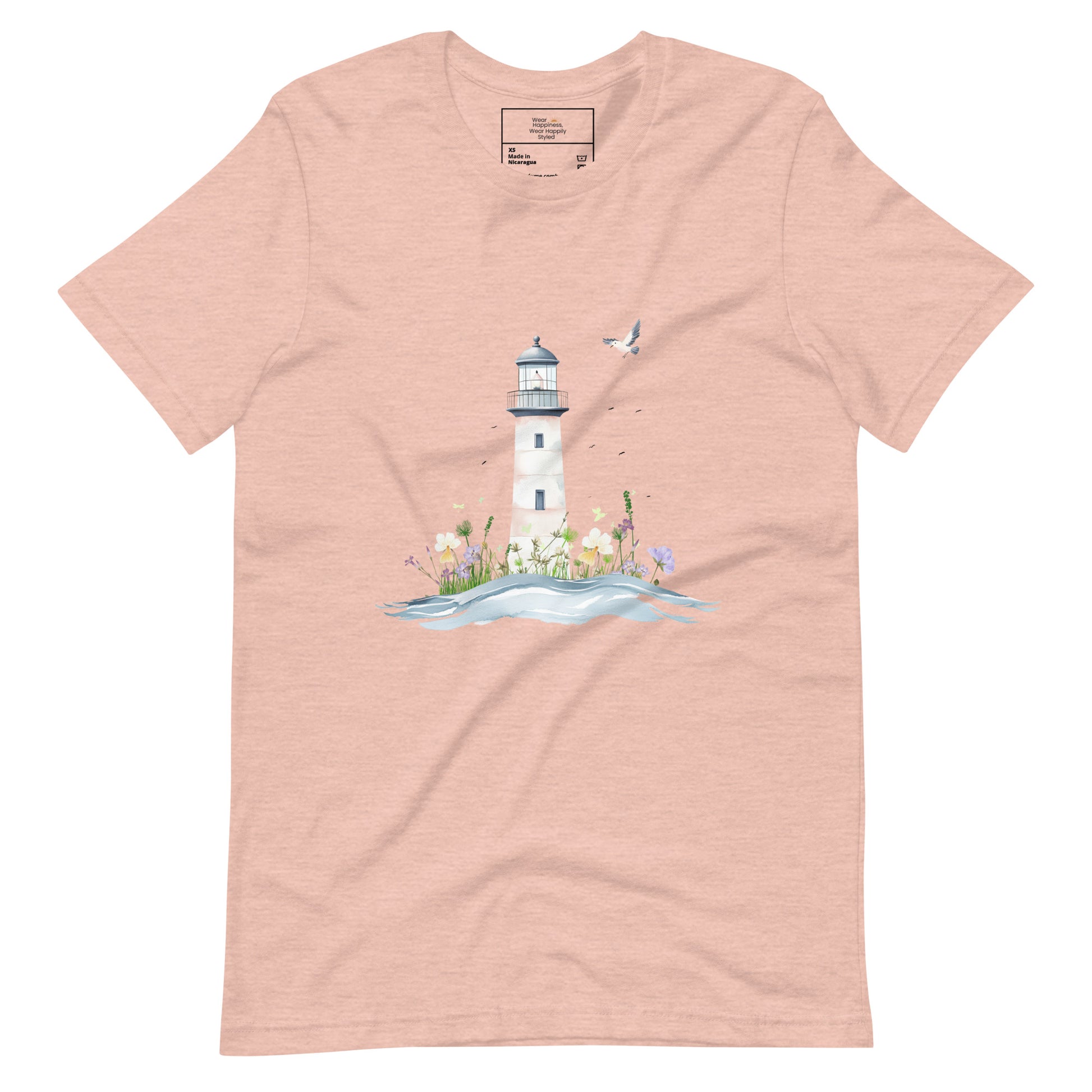 Peach-colored t-shirt laid flat featuring a serene lighthouse illustration with floral details and a seagull in flight, designed for peaceful mom style.